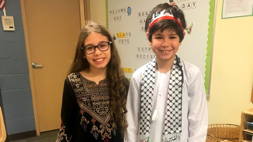 Two young children smiling